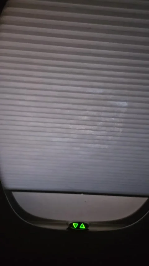 First class airplane window opening Stock Footage 316713956