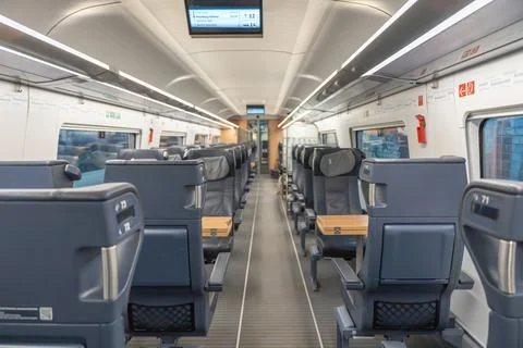 First class with overhead screens. Stock Photos