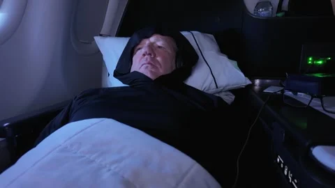 First Class Passenger Reclining And Watching In Flight Entertainment On A Stock Footage 317170534