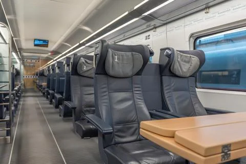 First class seats with table. Stock Photos