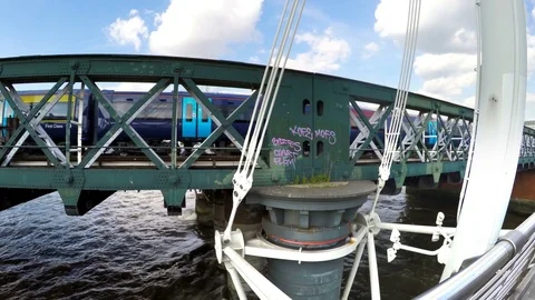 First class train passing on a bridge above Thames in London, UK Stock Footage 80065356