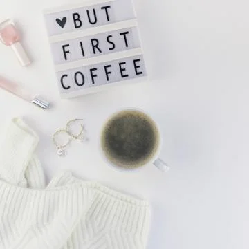 But first coffee text on lightbox with Coffee Cup Stock-Fotos