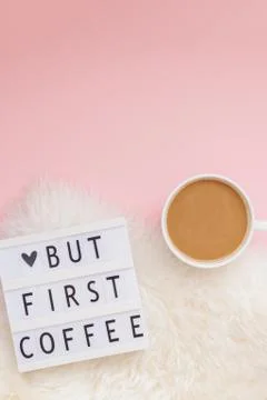 But first coffee text on lightbox with Coffee Cup Fotos de archivo