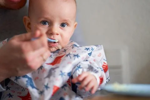 The first complementary feeding of a baby Fotos de archivo