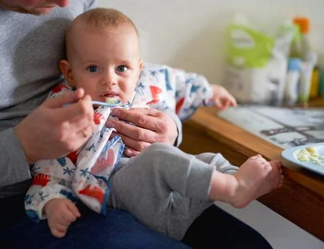 The first complementary feeding of a baby Stock Photos