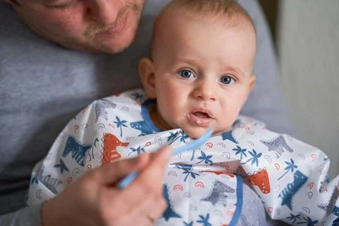 The first complementary feeding of a baby Fotos de archivo