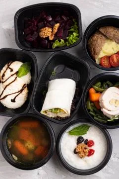 First course - pickle soup with vegetables in food containers Stock Photos
