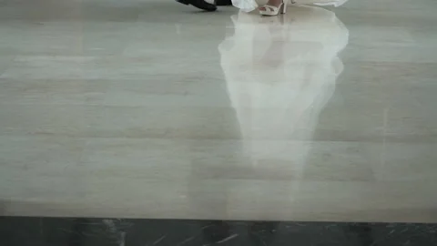 First Dance of the Bride and Groom. Young couple dancing together. Reflection of Stock Footage 161120151