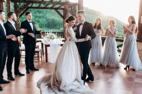 The first dance of the young. The bride and groom are dancing their first dance. Stock Photos