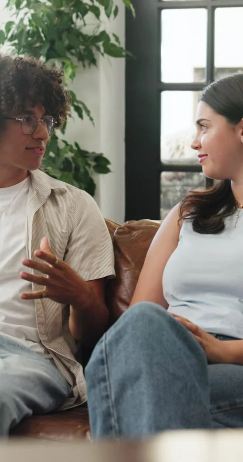 First date, connection or couple in house with chat, chill or bonding together Stock Footage 329399821