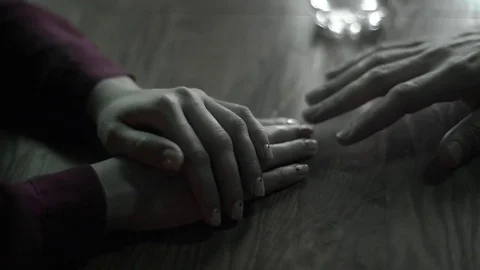 First date. Male hand touching female Stock Footage