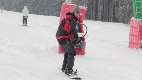 First day riding a snowboard Stock Footage 90814128