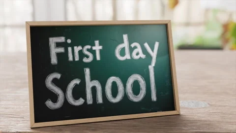 First Day School Chalkboard Sign Set on Wooden Table With Blurred Background Stock Footage 315393953