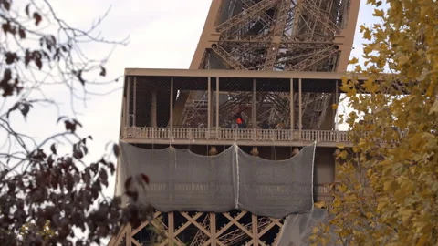 First floor of the Eiffel Tower on sunny day with protective nets in Paris Stock Footage 223501408