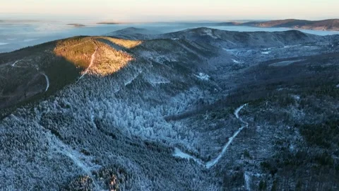 First Golden Sunlight on Winter Mountain Peak Stock Footage 335584388