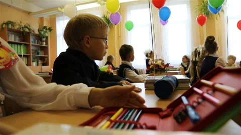 The first-grader is preparing for the first lesson at the school Stock Footage 106094831
