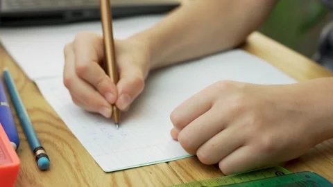 A First-Grader Primary School Child Kid Is Taught Online At Home. A Student Adds Stock Footage 140521570
