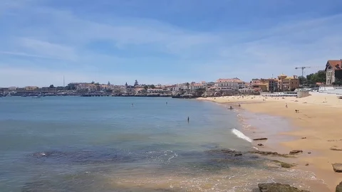 The first holidaymakers on the beach in Cascais. Stock Footage 108561854