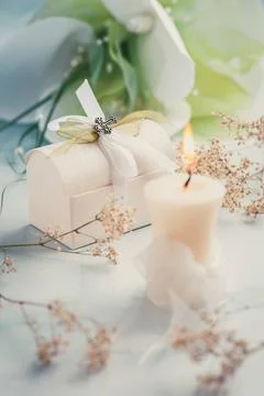 First holy communion or confirmation - candle with flowers and small prese... Stock Photos