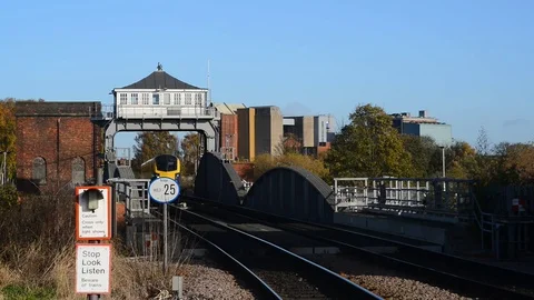 First hull train class 180 adelantes crossing swingbridge selby uk Stock Footage 82344387