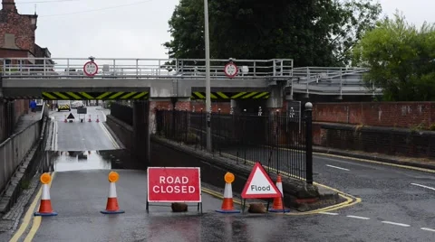 First hull train crossing flooded and closed road selby uk Stock Footage 52887807