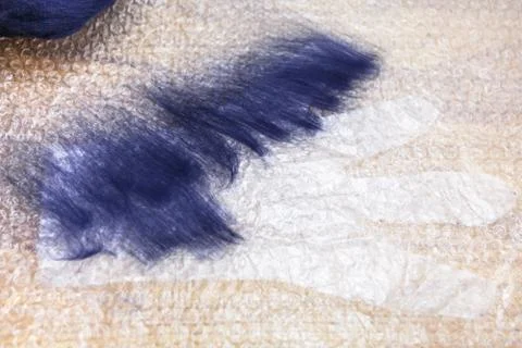 First layer of fibers on cutting pattern of glove 库存照片