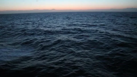 First light of dawn in the middle of the sea during a crossing Stock Footage 310199101