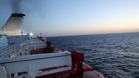 First light of dawn in the middle of the sea during a crossing Stock Footage 310558387