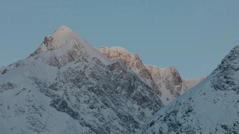 The first light of the day is hitting the mountain peaks Stock Footage 101912712