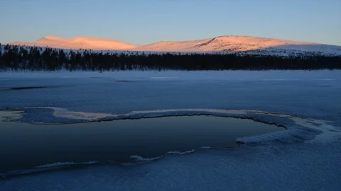 First light on mountain which reflects in water Stock Footage 85901720