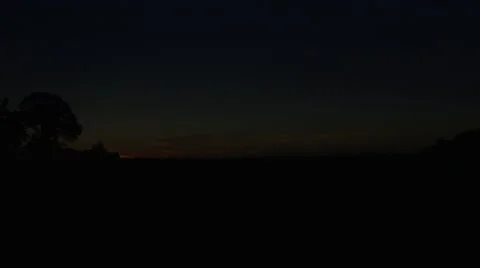 First light sunrise timelapse over green farm field Midwest. Stock Footage 63213233