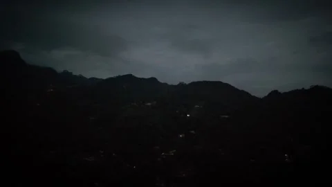 First Light Washes Over Mountain Ridge Under Fading Night Stock Footage 316795201