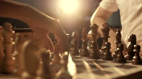 The first move of a pawn in chess. Chess board, close-up. Cinematic Stock Footage 156707477