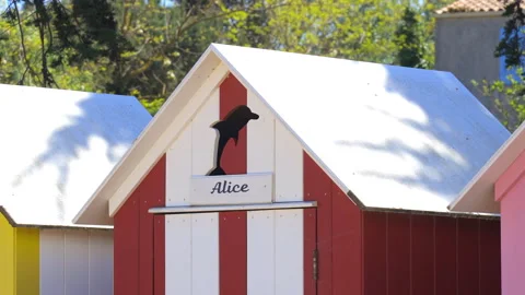 First name Alice painted on a colored wooden hut of La Bree-les-Bains, France Stock Footage 277258839