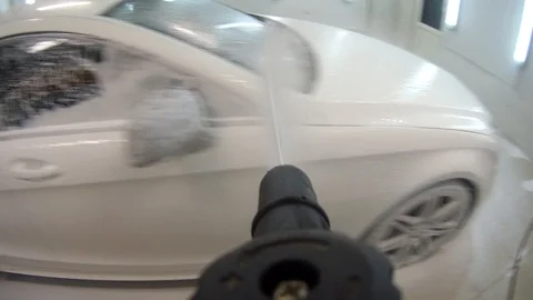 From the first person. Applying foam to the car. Car wash sprayer Stock Footage 127570147