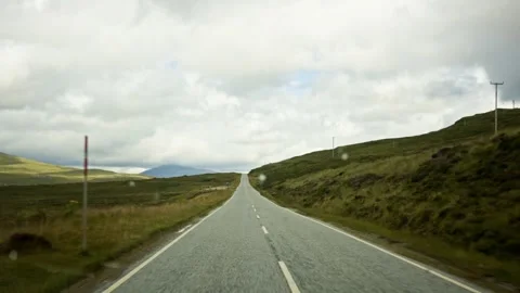 First Person Dashcam View of Scenic Country Road Through Green Hills in Peak Stock Footage 346598318