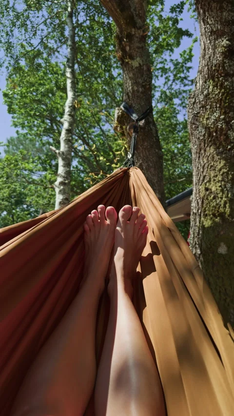 First person hammock relaxation under leafy trees Видео 343658754