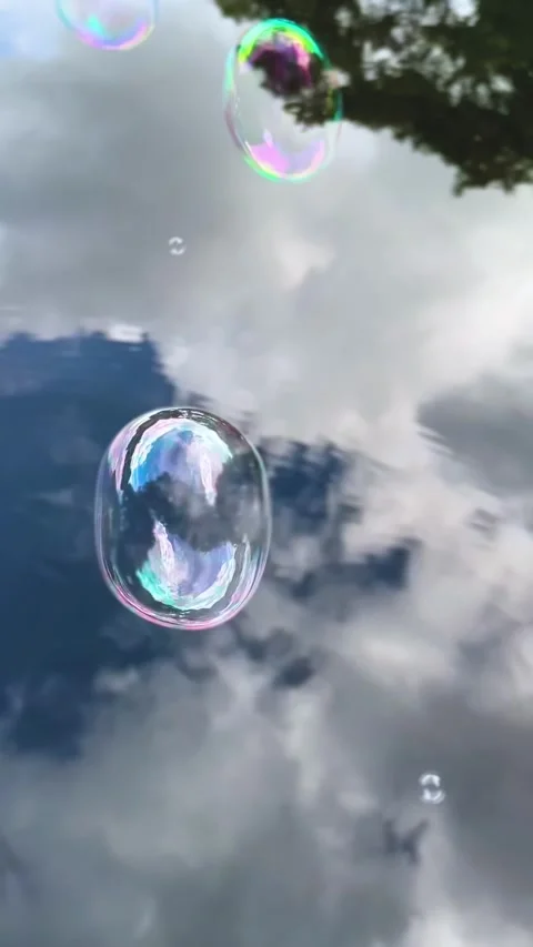 First-Person Iridescent Soap Bubbles Over Lake, Vertical Video Video stock 316499909