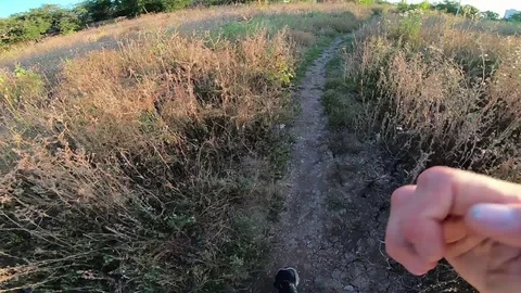 A first-person man runs along the trail with all his might Stock Footage 114564286