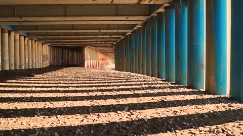 First-person passage over an old bridge covered with rust, over rocks Stock Footage 171603985