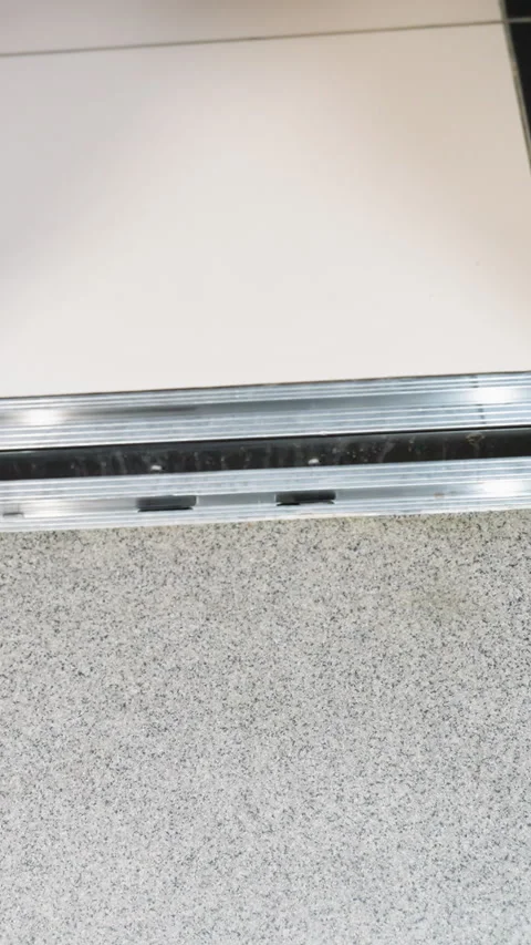 First-Person Perspective of a Black Booted Leg Walking into an Elevator Stock Footage 316506537