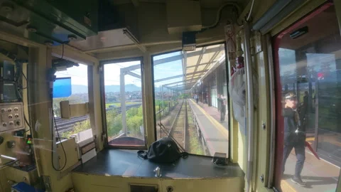 First-person perspective from the driver's cab of a train departing a station Stock Footage 333634089