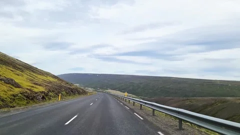 First person perspective driving along a scenic road through the desolate and Stock Footage 346326021