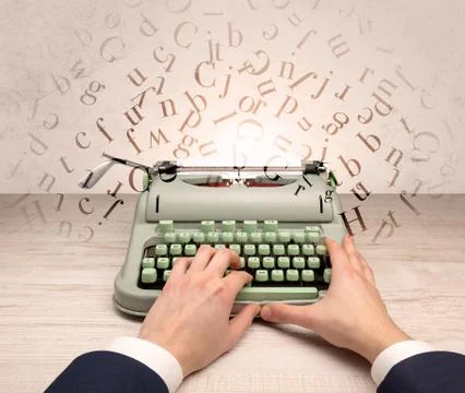 First person perspective elegant hand typing with flying letters concept Stock Photos