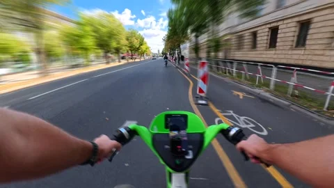 First person perspective hyperlapse of a lime electric scooter ride through a Stock Footage 327453320