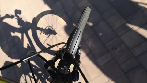 First-person perspective shot of a bicycle wheel Stock Footage 274755567