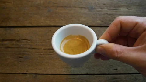 First person perspective of someone drinking from a espresso coffe cup. Stock Footage 148113355