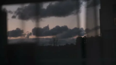 First person point of view looking outside through window glass on dusk sky. Stock Footage 160335916