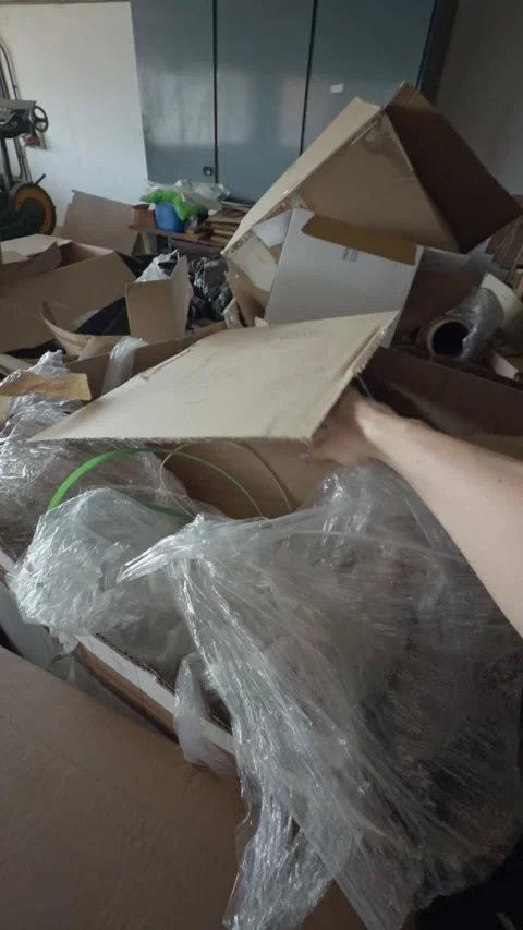 First person point of view looking for something in a messy warehouse Stock Footage 339670068
