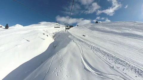 First person point of view riding a chairlift in the French Alps Stock Footage 84677868